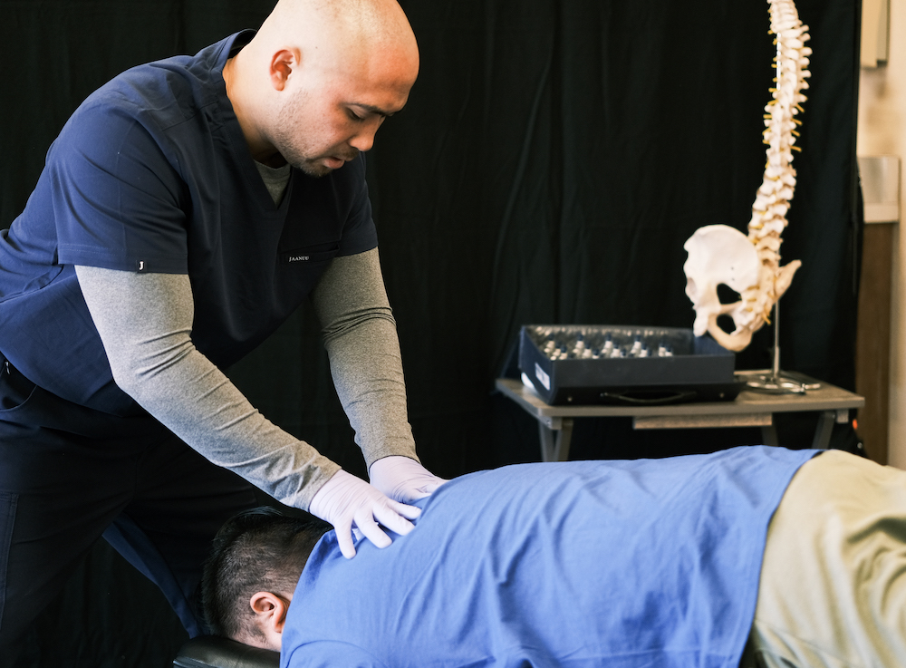 Dr. Jerald Chavez doing chiropractor adjustment