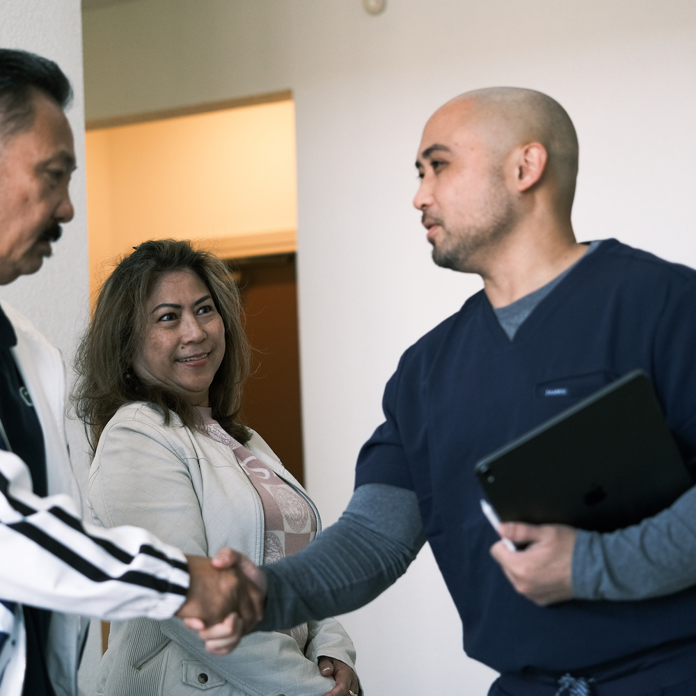 Dr. Jerald Chavez working with couple patient